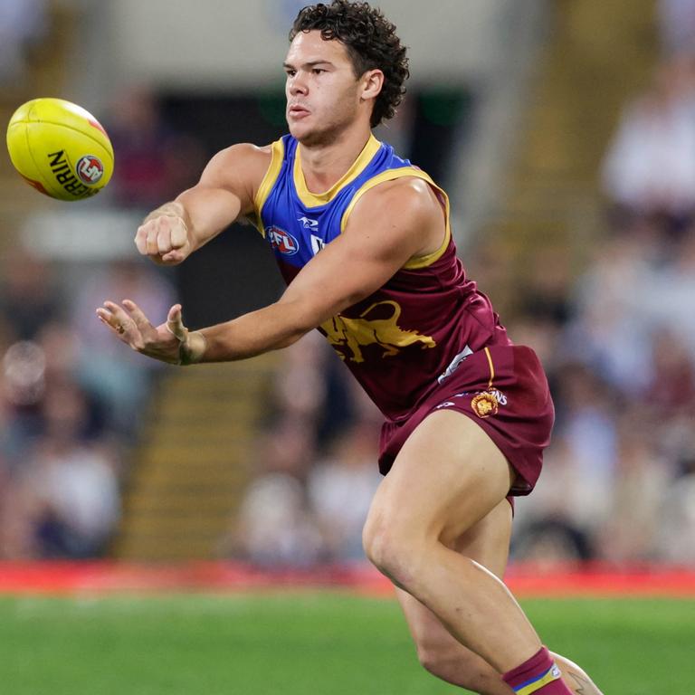 Cam Rayner shoots off a handball. Picture: Russell Freeman/AFL Photos via Getty Images