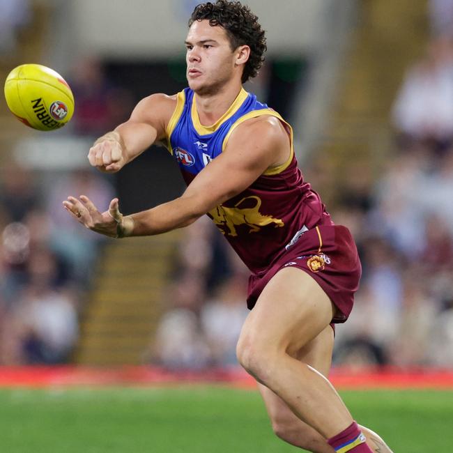 Cam Rayner shoots off a handball. Picture: Russell Freeman/AFL Photos via Getty Images