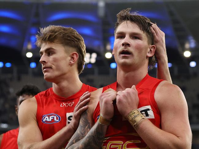 PERTH, AUSTRALIA - AUG 03: The Suns leave the field after the teams defeat during the 2024 AFL Round 21 match between the West Coast Eagles and the Gold Coast SUNS at Optus Stadium on August 03, 2024 in Perth, Australia. (Photo by Will Russell/AFL Photos via Getty Images)