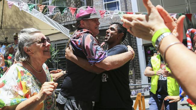 Rob Holt, who was formerly homeless and now volunteers, pictured embracing CEO and Pastor Jon Owen. Picture: Dylan Robinson