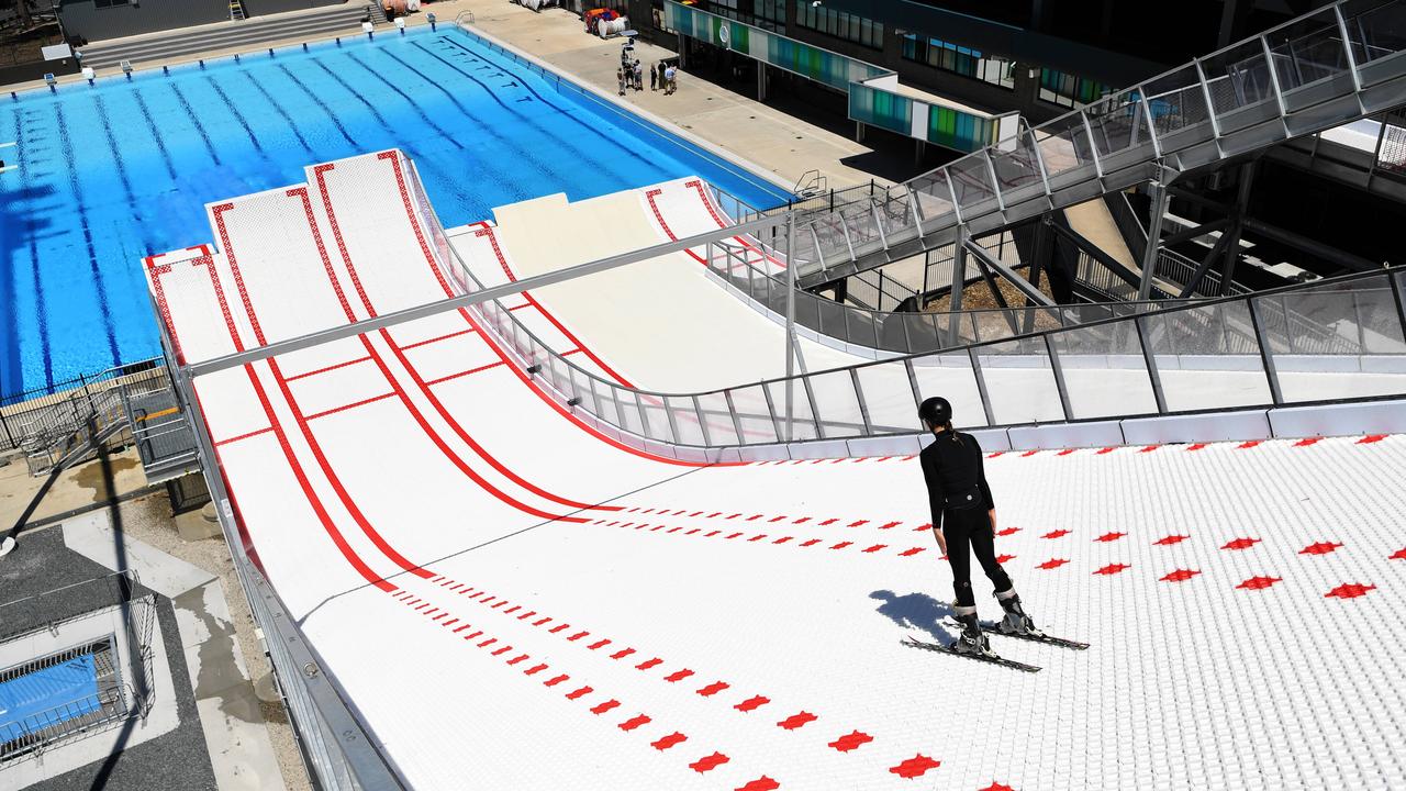 Freestyle skier Gabi Ash jumps into a swimming pool at the Sleeman Sports Complex in Brisbane. Picture: NCA NewsWire/Dan Peled