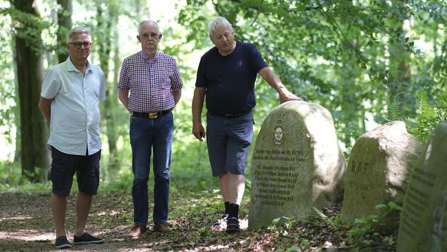 Danish historians Bjorn Allerelli Anderson, Larsen and Jens Peter Rasmussen at memorial stones near Sonderborg, Denmark. Picture: Jacquelin Magnay