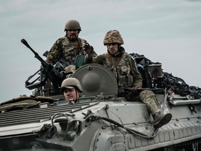 Ukrainian soldiers ride on an armoured personnel carrier in Sloviansk, eastern Ukraine. Picture: AFP