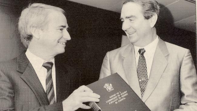 Tony Fitzgerald QC hands his Commission of Inquiry report to then premier Mike Ahern in 1989.