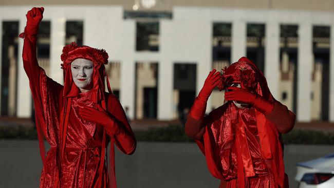 Red Rebels from the Extinction Rebellion movement block roads leading to Parliament House in Canberra. Picture: NCA NewsWire / Gary Ramage