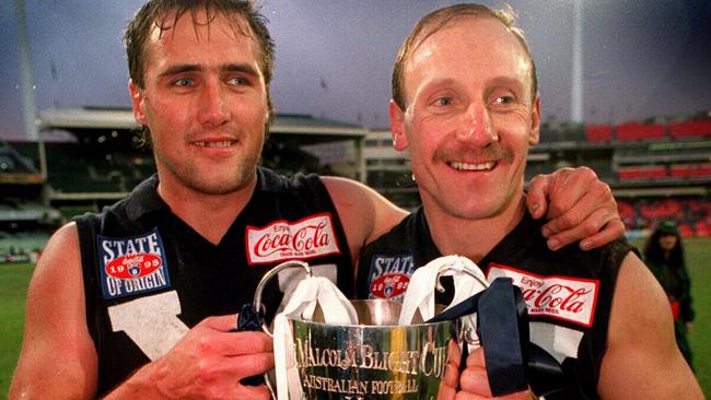 Tony Lockett and Gary Ablett Snr celebrate Victoria winning a State of Origin match at the MCG in 1995.