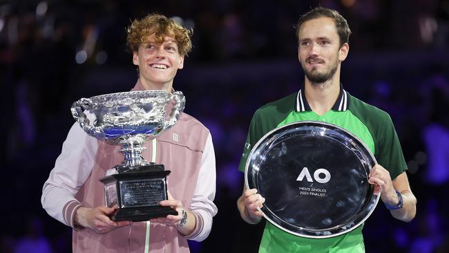 Jannik Sinner and Daniil Medvedev pose during the official presentation after their final at Melbourne Park Picture: Getty Images