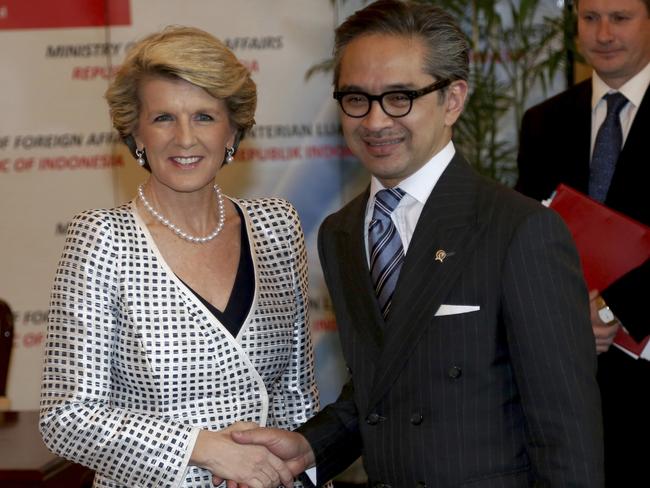 Australian Foreign Minister Julie Bishop, left, is greeted by his Indonesian counterpart Marty Natalegawa prior to their meeting in Jakarta, Indonesia in 2013. Picture: Tatan Syuflana