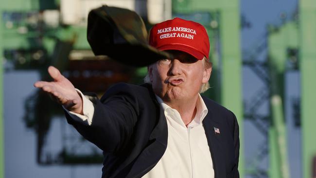 Republican presidential candidate Donald Trump signals his mood through his headwear.