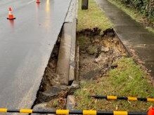 A burst water main has caused a hole to emerge on Warringah Rd, Narraweena . Picture: Sydney Water.