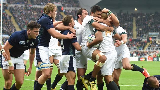 South Africa's wing JP Pietersen celebrates with South Africa's centre Damian de Allende.