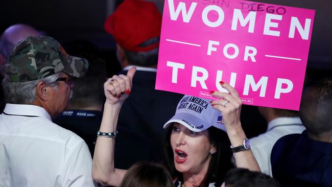 Women voted for Donald Trump. They even made signs to tell people their intentions to do so. (Pic: AFP)