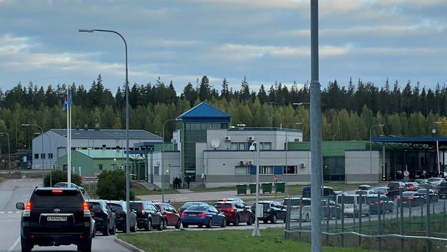 Cars queue to enter the Brusnichnoye checkpoint on the Russian-Finnish border in the Leningrad region on Thursday. Picture: Reuters