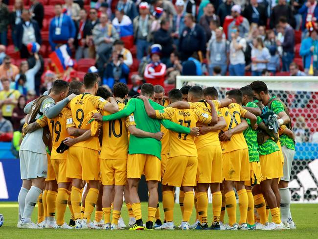 Jedinak gathers the Socceroos for a huddle in the middle of the pitch after their 2-1 defeat to France. Picture: Toby Zerna