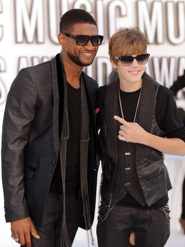 Bieber with mentor Usher, who also spent time with Diddy as a teenager, in 2010.