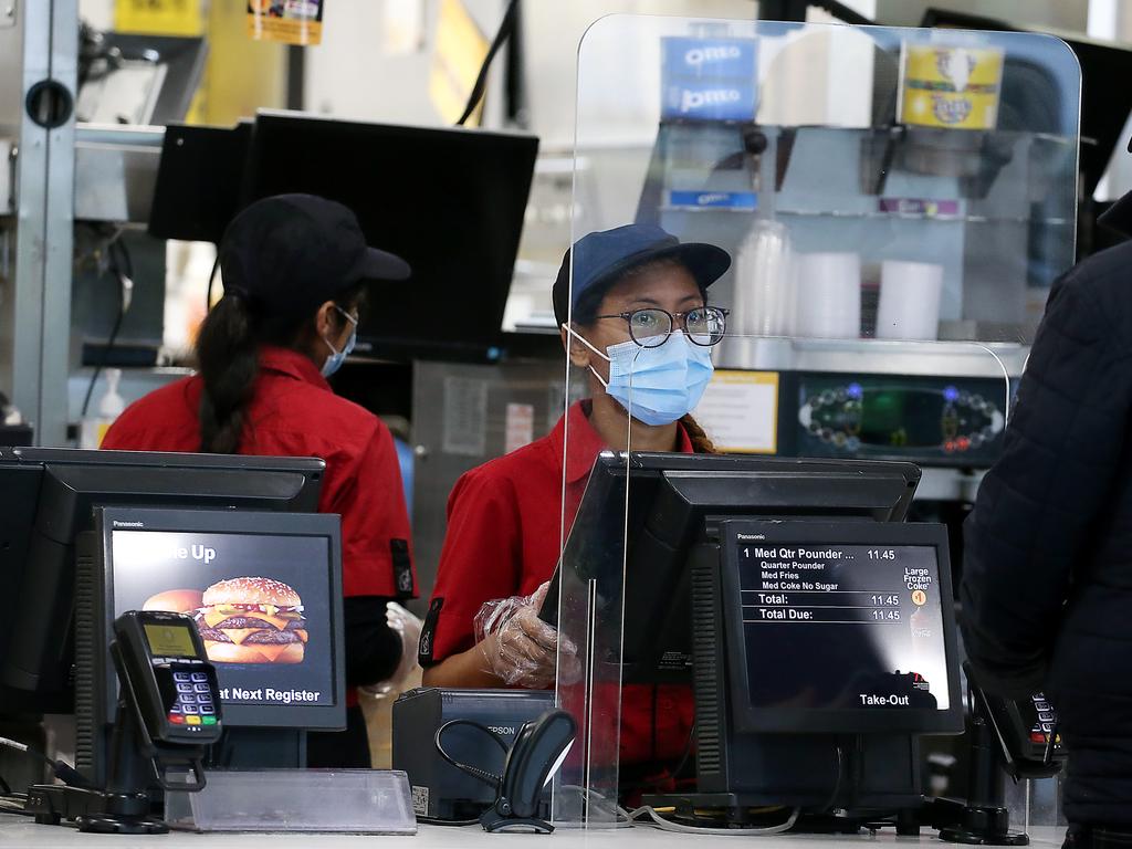 Like in the UK, McDonald’s staff in NSW and Melbourne wear face masks. Picture: Ian Currie/NCA NewsWire