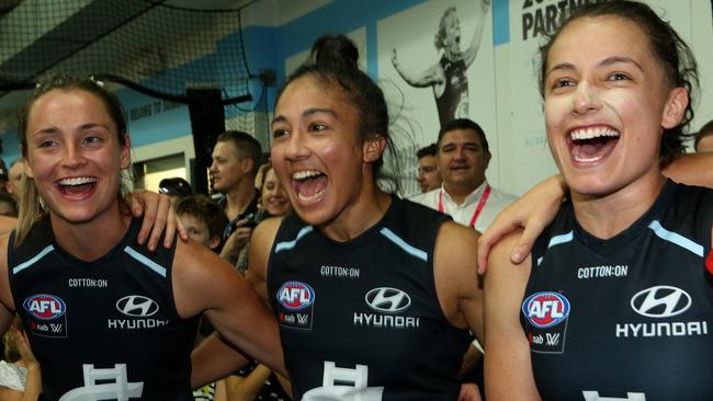 Darcy Vescio of the Blues (centre) celebrates with teammates in the Carlton rooms after a win. Picture: Hamish Blair. 