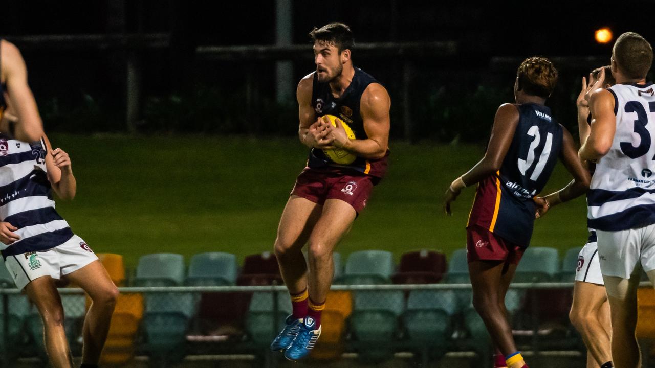 Cairns City Lions' Robert Turnbull makes a midfield catch. Picture: Emily Barker.