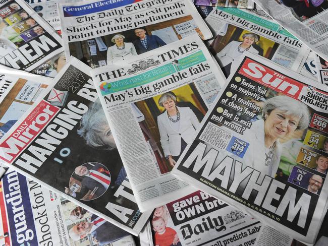 An arrangement of British daily newspapers are photographed as an illustration in London on June 9, 2017 showing front page stories about the exit poll results of the snap general election.  British Prime Minister Theresa May faced pressure to resign on June 9 after losing her parliamentary majority, plunging the country into uncertainty as Brexit talks loom. The pound fell sharply amid fears the Conservative leader will be unable to form a government and could even be forced out of office after a troubled campaign overshadowed by two terror attacks. / AFP PHOTO / DANIEL SORABJI