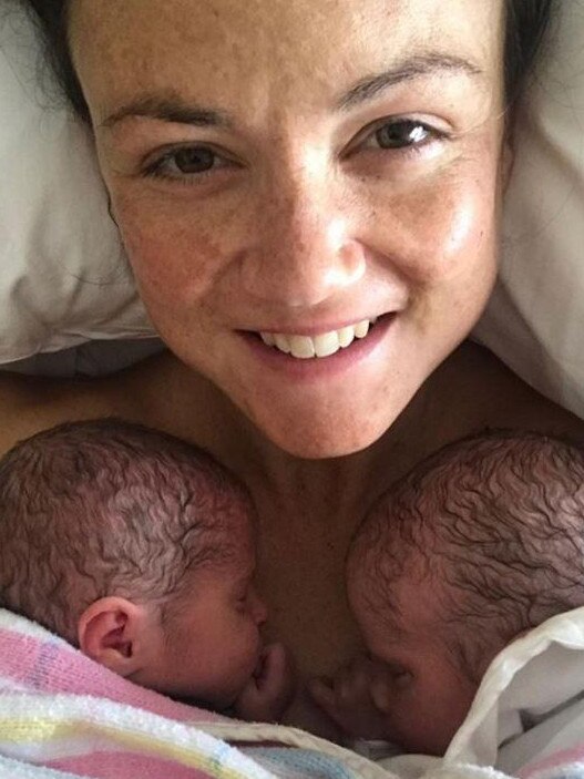 Daisy with her newborn twins, Sylvie and Roy.