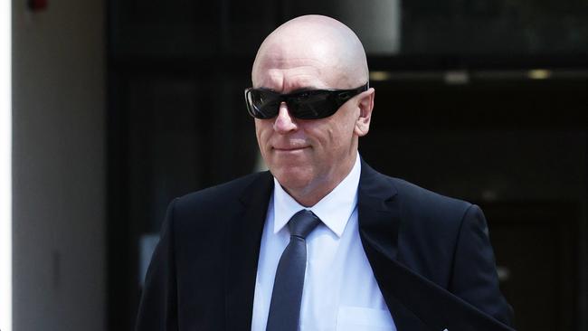 Mt Garnett police officer Sergeant Lee Adam Golding leaves the Cairns District Court after pleading not guilty to assault occasioning bodily harm. Picture: Brendan Radke