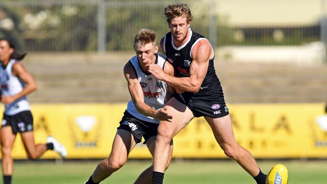 Port’s Tom Jonas bumps Todd Marshall on Friday. Picture: Tom Huntley