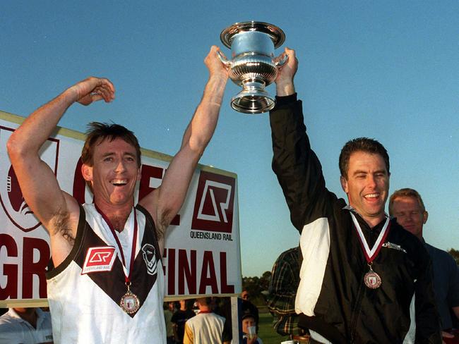 Graham/Huttonpix 19 sept 1999 winners, Southport Aussie Rules captain David Bain and  coach Jason Cotter with the trophy after defeating Coorparoo in the QSFL grand final.  35/S/13686 sport headshot