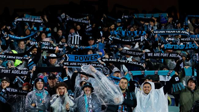 Port Adelaide fans sing Never Tear Us Apart before the game. Picture: Dylan Burns/AFL Photos