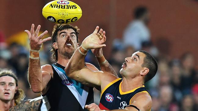 Taylor Walker battles for possession with Scott Lycett.