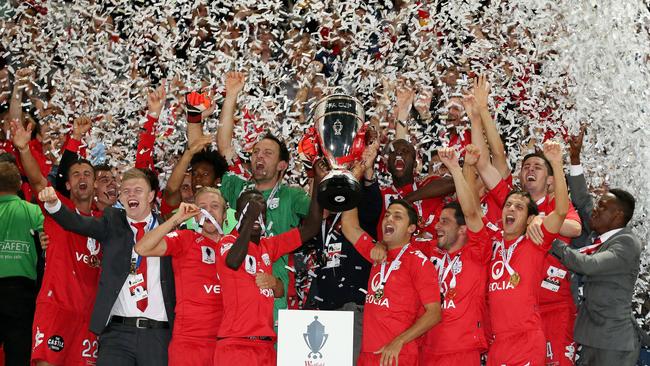 Skipper Eguene Galekovic lifts the FFA Cup in the knockout competition’s inaugural year. Picture: Sarah Reed