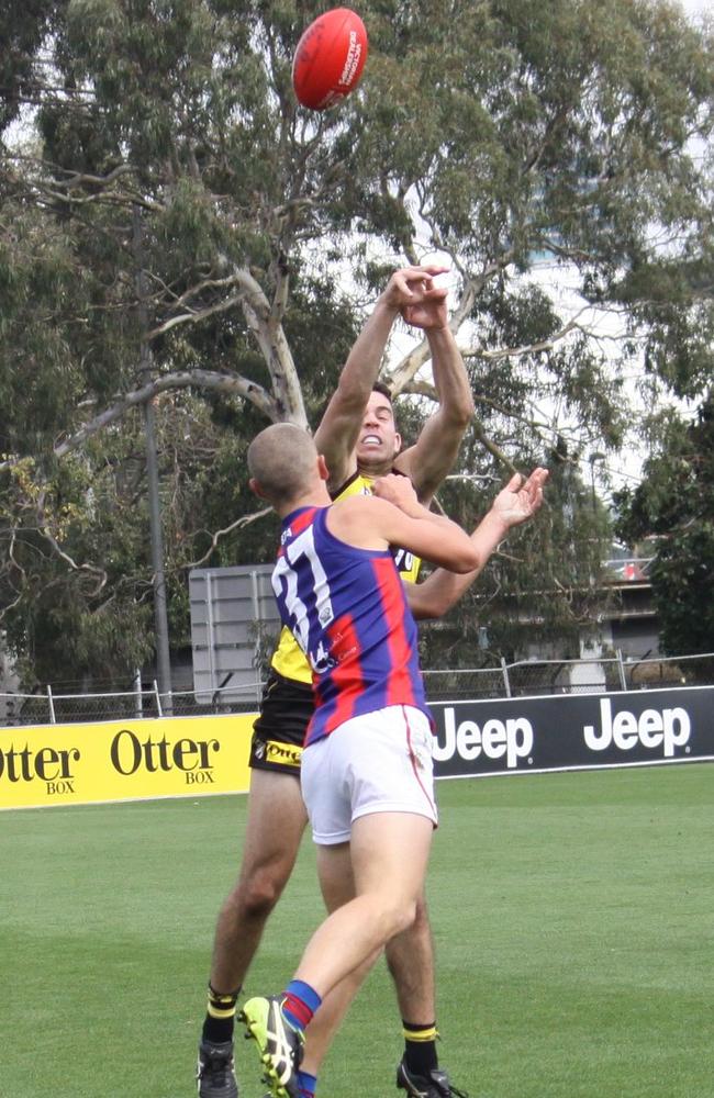 Harvey Hooper gets away a handball against Richmond in Round 1. Pic: Tony Cannatelli.