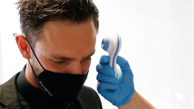 Hawk Jack Gunston has his temperature checked before entering the Melbourne Brownlow venue. Picture: Getty Images