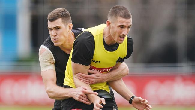 Mason Cox has a hold of Darcy Cameron here, but Cameron has kept him at bay at selection. Picture: AAP Image/Michael Dodge