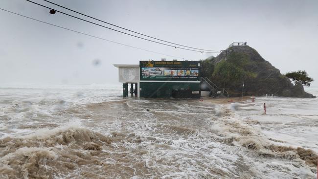 Huge surf from Cyclone Alfred smashes into the Currumbin coastline, washing through the Cururrumbin SLSC carpark and tearing up the surface, scattering it along the beach. Picture Glenn hampson