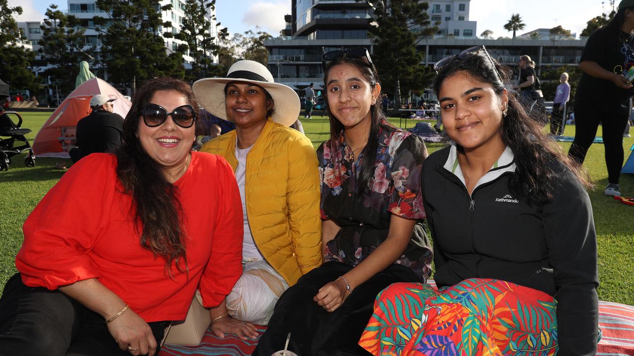 Neha Sharma and Binita Poonam with Aahana and Kaishi. Locals and visitors arrived early to get a good spot for the Geelong New Years Eve celebrations. Picture: Alan Barber