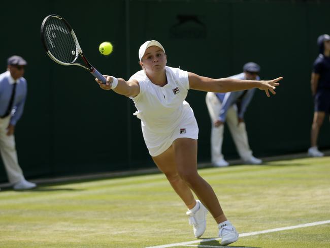 Ashleigh Barty of Australia returns a ball to Daria Kasatkina of Russia during their women's singles match on the sixth day at the Wimbledon Tennis Championships in London, Saturday July 7, 2018. (AP Photo/Tim Ireland)