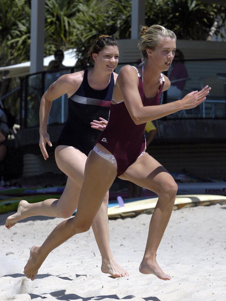 Jaimi Kenny (right) in 2005, competes in the under 15 girls flags at the secondary schools surf league. Picture: Lou O'Brien