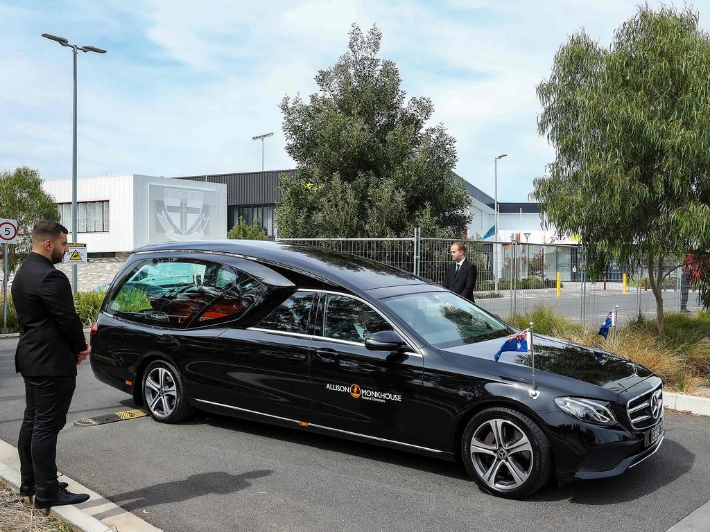 After the service, the hearse leaves the St Kilda Football Club. Picture: Ian Currie