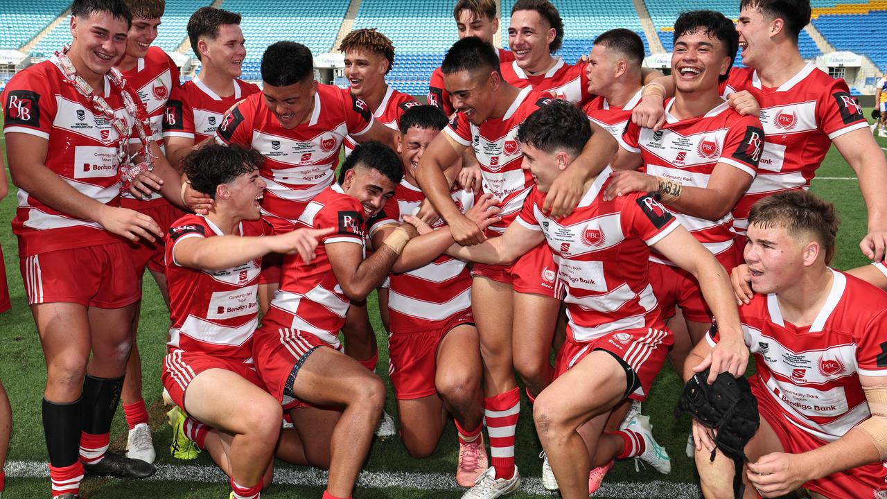 NRL National Schoolboys Cup final at CBUS Stadium between Palm Beach Currumbin and Patrician Blacktown Brothers. The Red Army and Palm Beach Currumbin players celebrate the win. .Picture Glenn Hampson