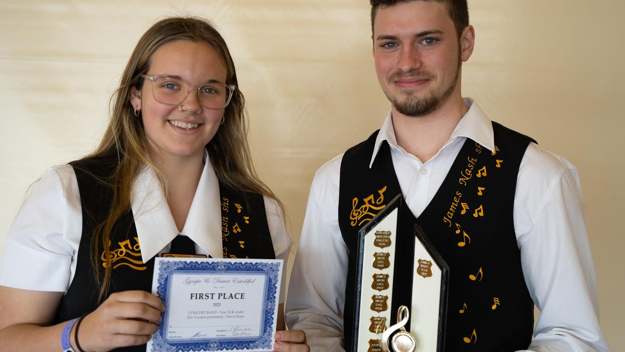 Congratulations: Phoebe Penny and Thomas Allen triumphantly holding the winning trophy for the James Nash State High School Concert Band. July 31, 2023. Picture: Christine Schindler