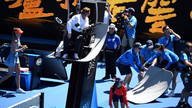 Chair umpire Alison Hughes assesses the damage after a narrow Spider-Cam miss.