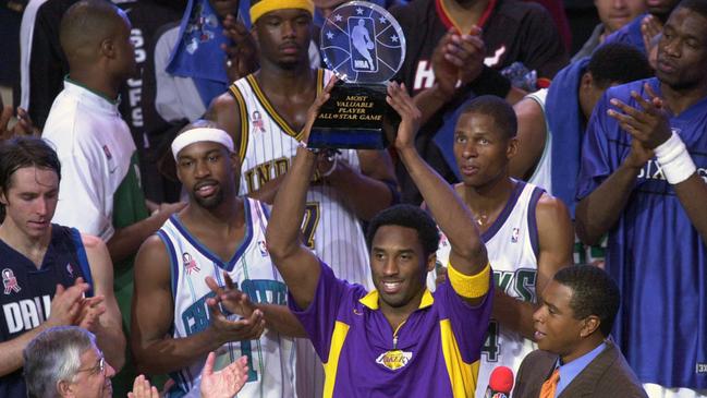 Western Conference All-Star Kobe Bryant, of the Los Angeles Lakers, holds up his MVP trophy following the 2002 NBA All-Star basketball game in Philadelphia. Picture: AP