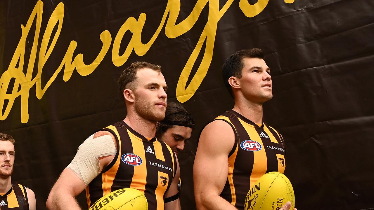 Tom Mitchell and Jaeger O’Meara of the Hawks.