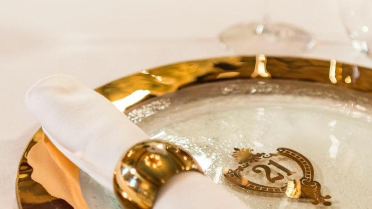 Tables are set with gold-plated crystal dinnerware. Picture: Walt Disney Parks