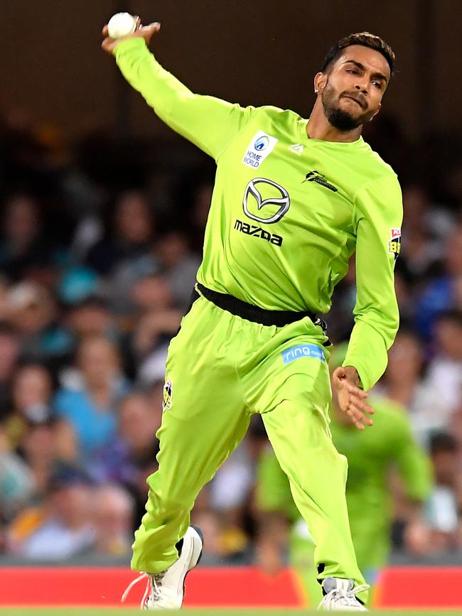 Arjun Nair bowling for the Sydney Thunder.