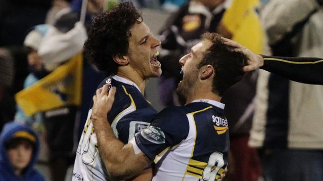 CANBERRA, AUSTRALIA - JULY 11: Matt Toomua of the Brumbies is congratulated by Nic White after scoring a try during the round 19 Super Rugby match between the Brumbies and the Force at Canberra Stadium on July 11, 2014 in Canberra, Australia. (Photo by Stefan Postles/Getty Images)