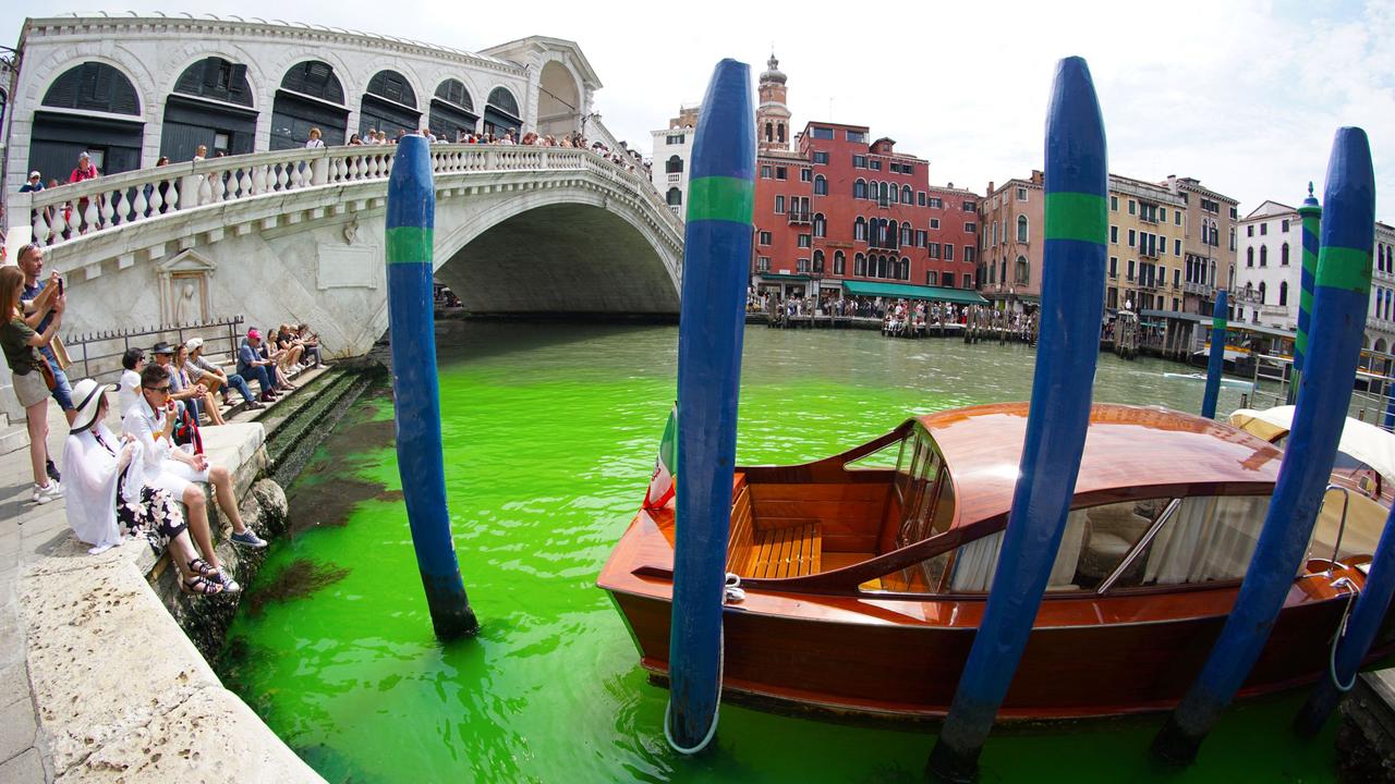 Authorities in Venice are urgently investigating why the city’s famous Grand Canal has suddenly turned green. Picture: Stringer/ANSA/AFP