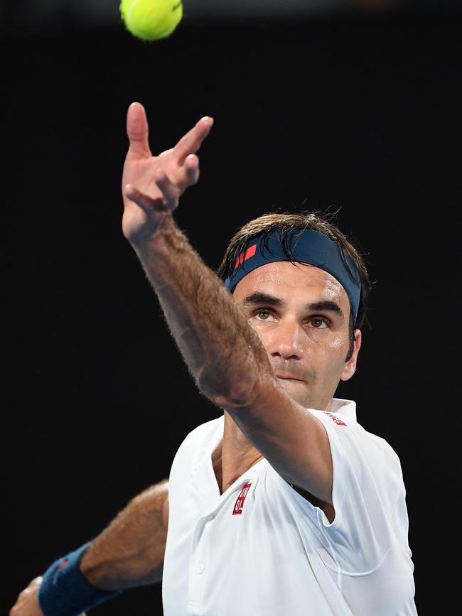 Roger Federer sends down a rocket to Taylor Fritz.