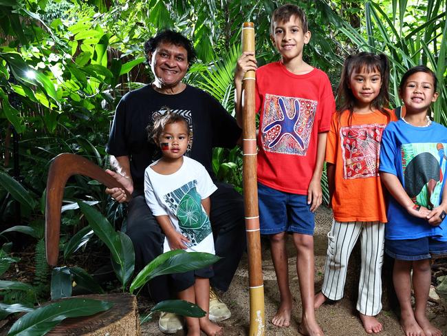Well known and respected indigenous artist Munganbana, also known as Norman Miller, has launched a range of fashion items, including shirts for adults and children, featuring his most popular and distinctive artwork. Artist Norman Miller, Timote Fukofuka, 3, Caiden Villaflor, 11, and Dream Barlow-Fukofuka, 6, model Munganbana Style Up Fashion T shirts. Picture: Brendan Radke