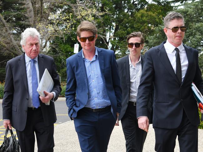 McLean (second left) and stable employee William Hernan (second right) attend a Racing Victoria hearing this month.